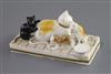 A Rockingham porcelain group of a cat and three kittens, c.1826-30, L. 11cm                                                            