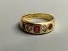 A late Victorian 18ct gold and gypsy set three stone ruby and two stone diamond half hoop ring                                                                                                                              