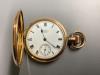 A gold plated Waltham hunter pocket watch.                                                                                                                                                                                  