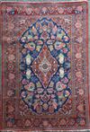 A Kashan blue ground rug, 6ft 8in by 4ft 5in.                                                                                          