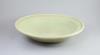 A Chinese Ming Longquan celadon dish, 15th/16th century, 43cm diameter                                                                                                                                                      