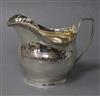 A George III silver helmet shaped cream jug, London, 1805, 88mm.                                                                       