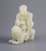 A good Chinese pale celadon jade group of Liu Hai and the three legged toad, 18th century, 8cm high, the wood stand carved with swirling waves                                                                              