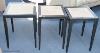 A pair of ebonised ash and parchment topped lamp tables, each 40 cm wide, 60 cm high, and a similar larger table 45 cm wide (three)                                                                                         