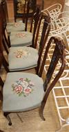 A set of four late Victorian salon chairs with pierced splats and floral tapestry seats                                                