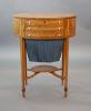 A George III rosewood banded satinwood oval work table, W.54.5cm D.39cm H.70cm                                                                                                                                              