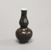 A Chinese Vungtao cargo black glaze miniature double gourd vase, height 7cm                                                                                                                                                 