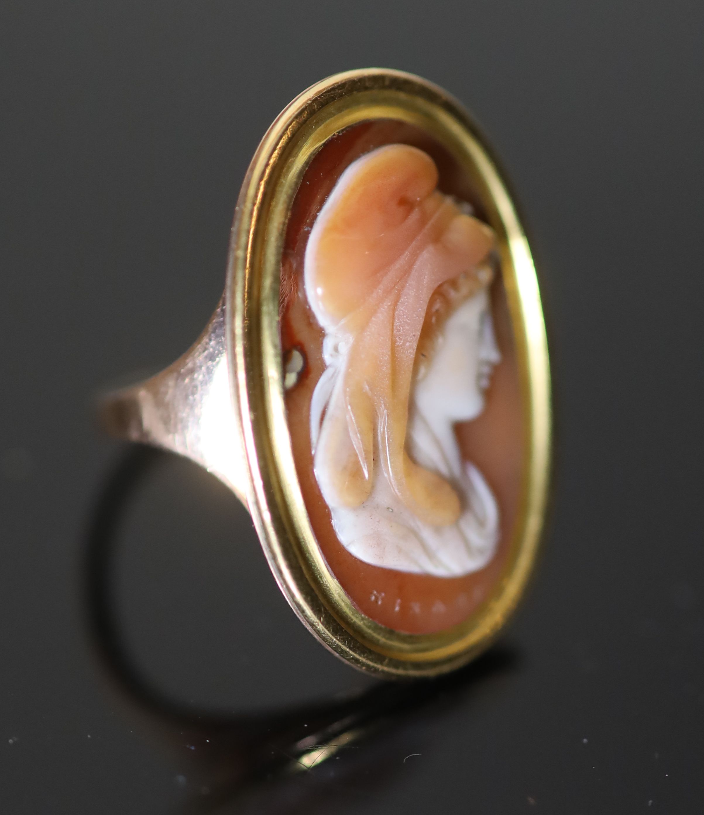 A 19th century gold and oval cameo sardonyx set ring, A 19th century gold and oval cameo sardonyx set ring,