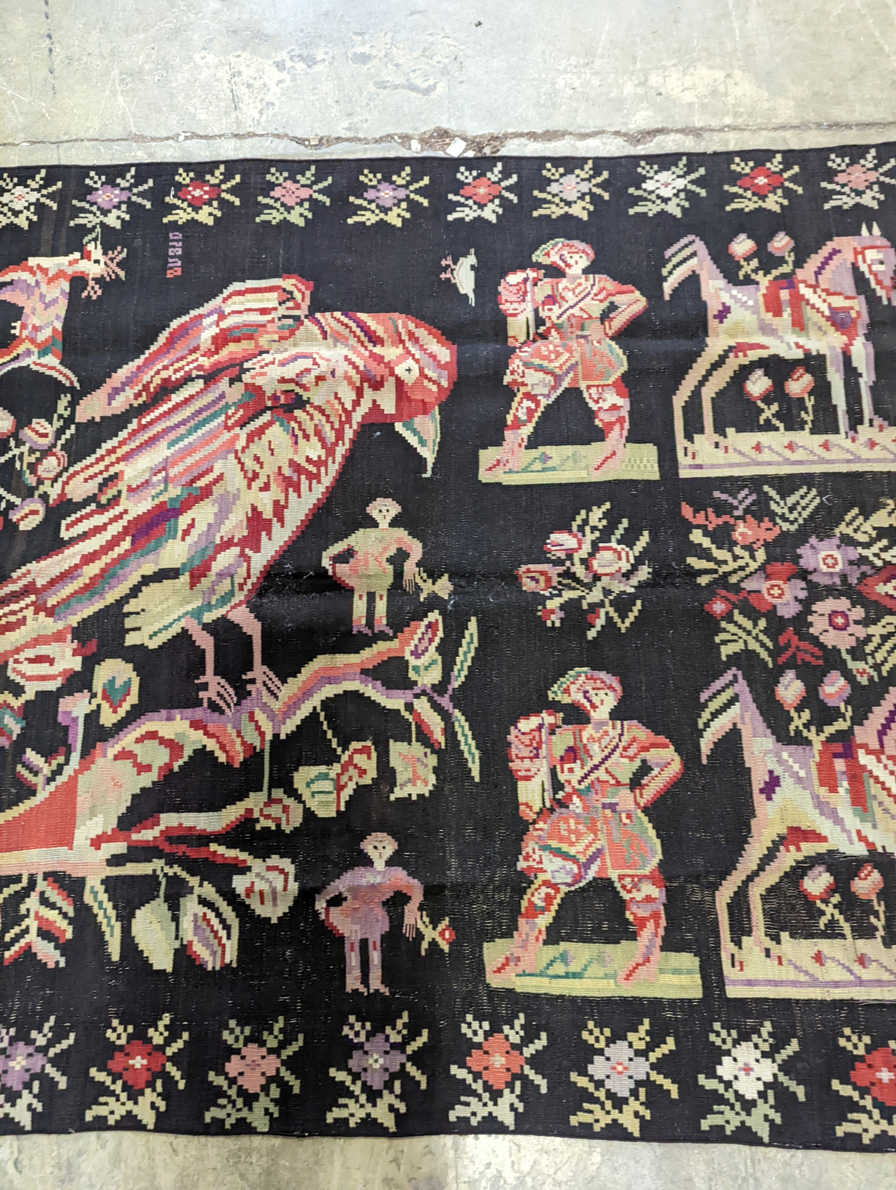 An antique Besbarabiam Kelim flatweave carpet woven with figures and birds, approx. 350 x 170cm