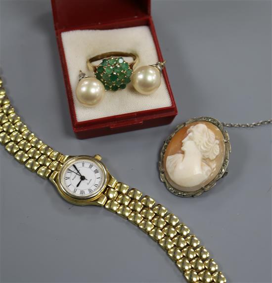 A ladys Mappin and Webb wrist watch, a yellow metal and emerald cluster dress ring, a cameo brooch and pair of ear studs. A ladys Mappin and Webb wrist watch, a yellow metal and emerald cluster dress ring, a cameo brooch and pair of ear studs.