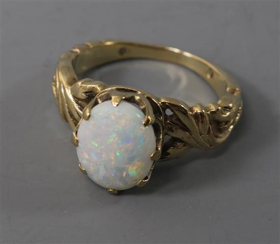 A 9ct? gold and white opal dress ring, size I. A 9ct? gold and white opal dress ring, size I.