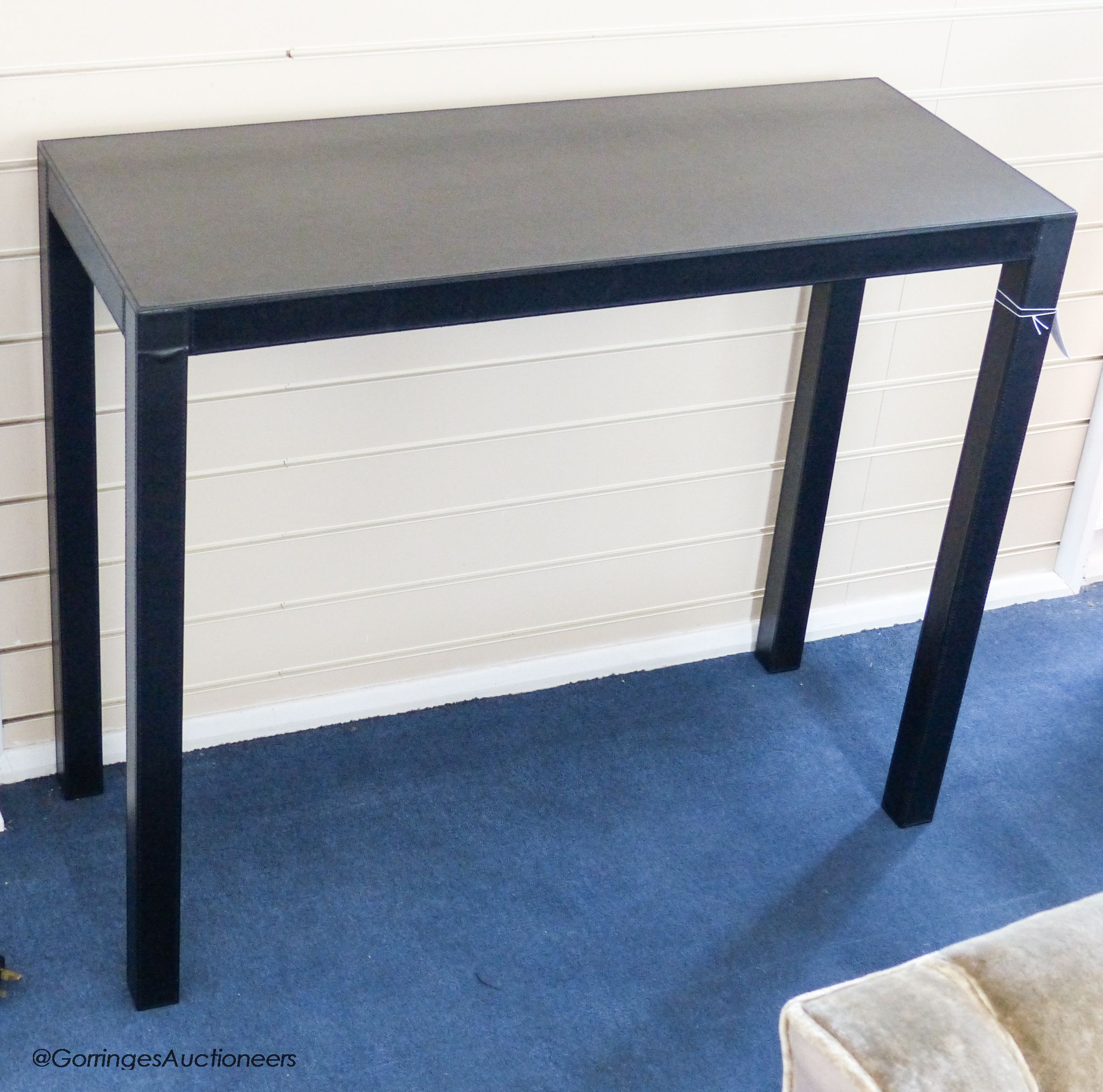 A contemporary black leather covered hall table, 100.5 cm long, 40 cm deep, 82.5 cm high