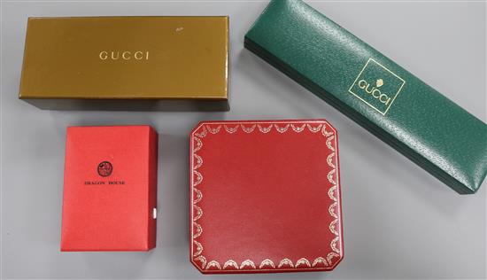 One Cartier box, two Gucci boxes and a Dragon House box. One Cartier box, two Gucci boxes and a Dragon House box.