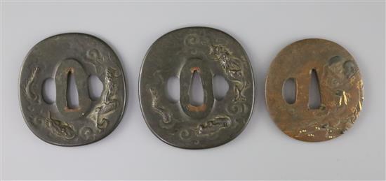 A set of Japanese daisho tsuba and a bronze and mixed metal tsuba, 19th century, 7cm (3) A set of Japanese daisho tsuba and a bronze and mixed metal tsuba, 19th century, 7cm (3)