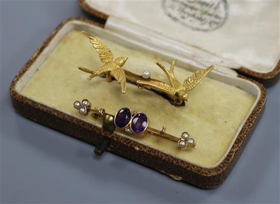 An Edwardian 15ct gold and seed pearl twin swallow brooch and a yellow metal gem set bar brooch. An Edwardian 15ct gold and seed pearl twin swallow brooch and a yellow metal gem set bar brooch.
