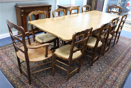 A late 19th century French parquetry oak extending dining table W.240cm