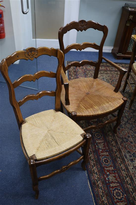 A set of ten French oak and beech dining chairs (8 single, 2 elbow)