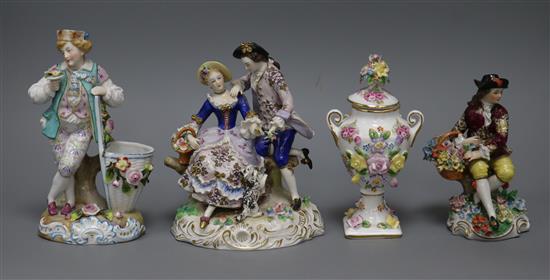 Three Continental figure groups and a lidded floral encrusted vase tallest 18.5cm