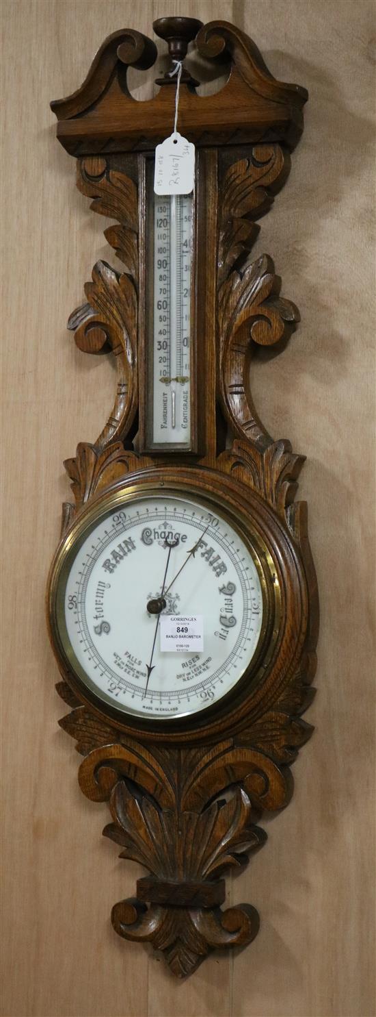 An oak banjo barometer W.25cm
