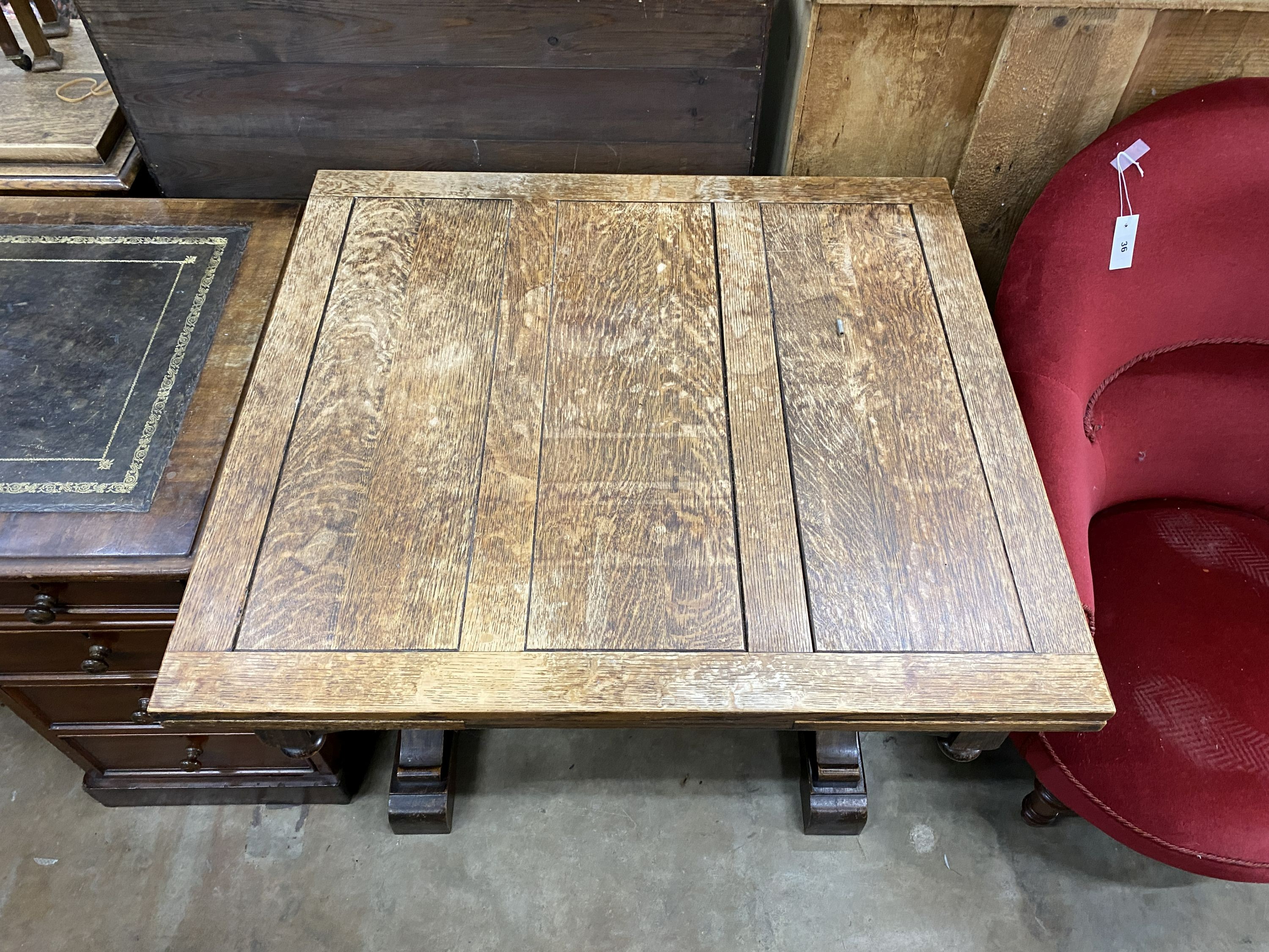 A 1930's oak draw leaf dining table, length 92cm, width 84cm, height 76cm