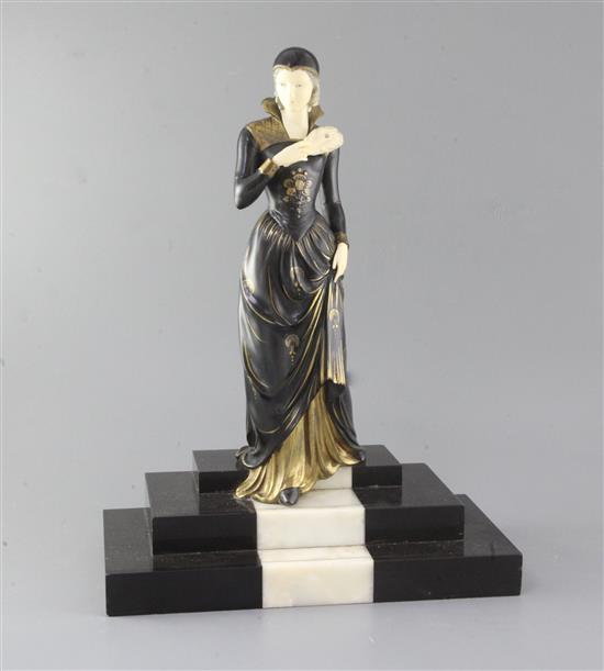 E.Menneville. A French Art Deco phenolic and bronzed spelter figure of a lady descending a staircase, LElegante, 17.5in. E.Menneville. A French Art Deco phenolic and bronzed spelter figure of a lady descending a staircase, LElegante, 17.5in.