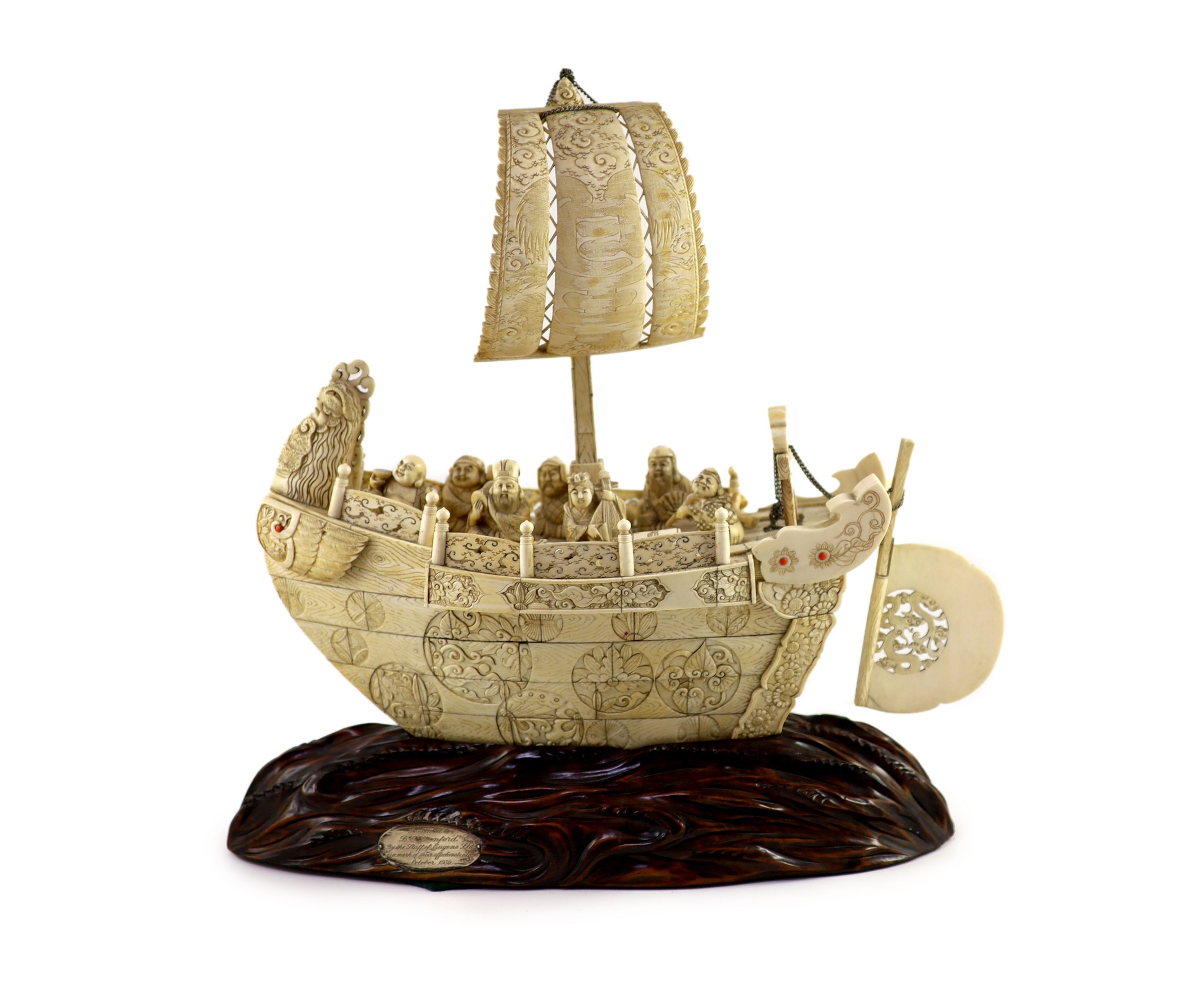 A large Japanese ivory okimono of the seven Gods of Happiness treasure ship the Takarabune, early Showa period, Total height 42 cm, length 41 cm, slight faults