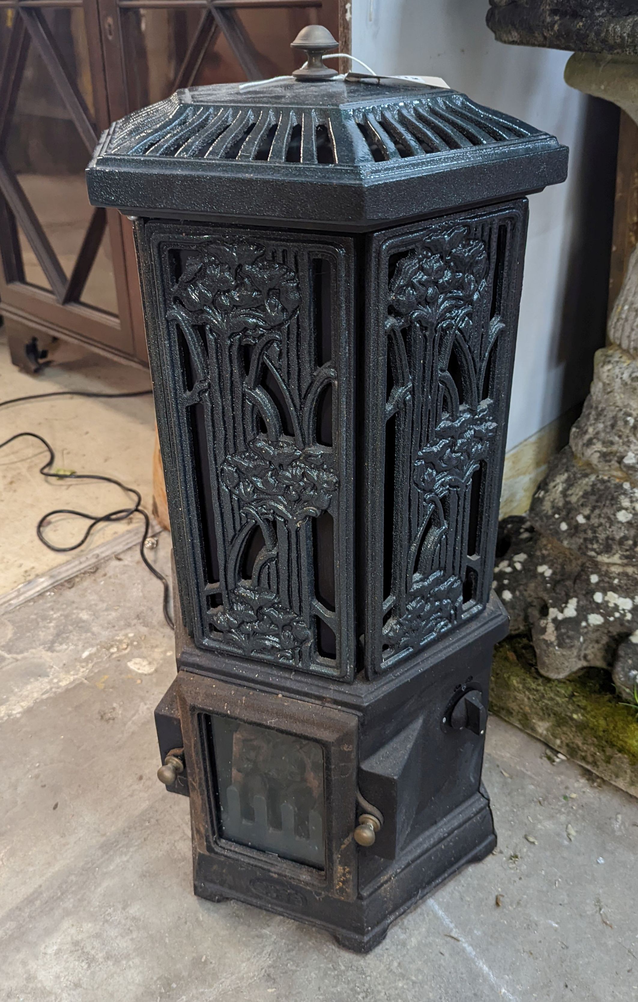A Victorian style Esse Firemaster Solo hexagonal electric cast iron framed conservatory heater, height 76cm