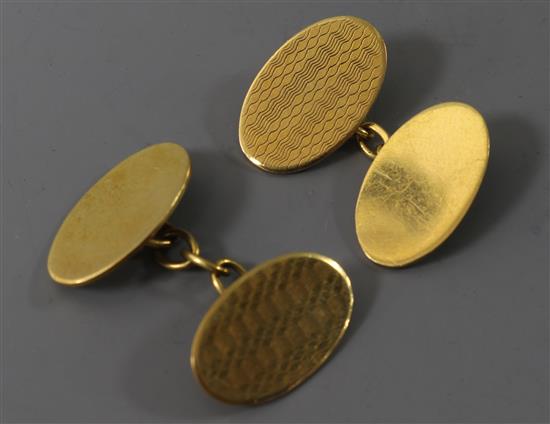A pair of 9ct gold oval cufflinks. A pair of 9ct gold oval cufflinks.