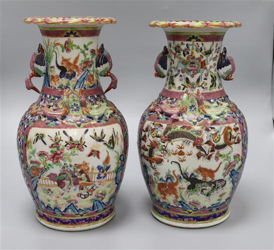 A pair of Chinese 19th century famille rose vases height 33cm A pair of Chinese 19th century famille rose vases height 33cm