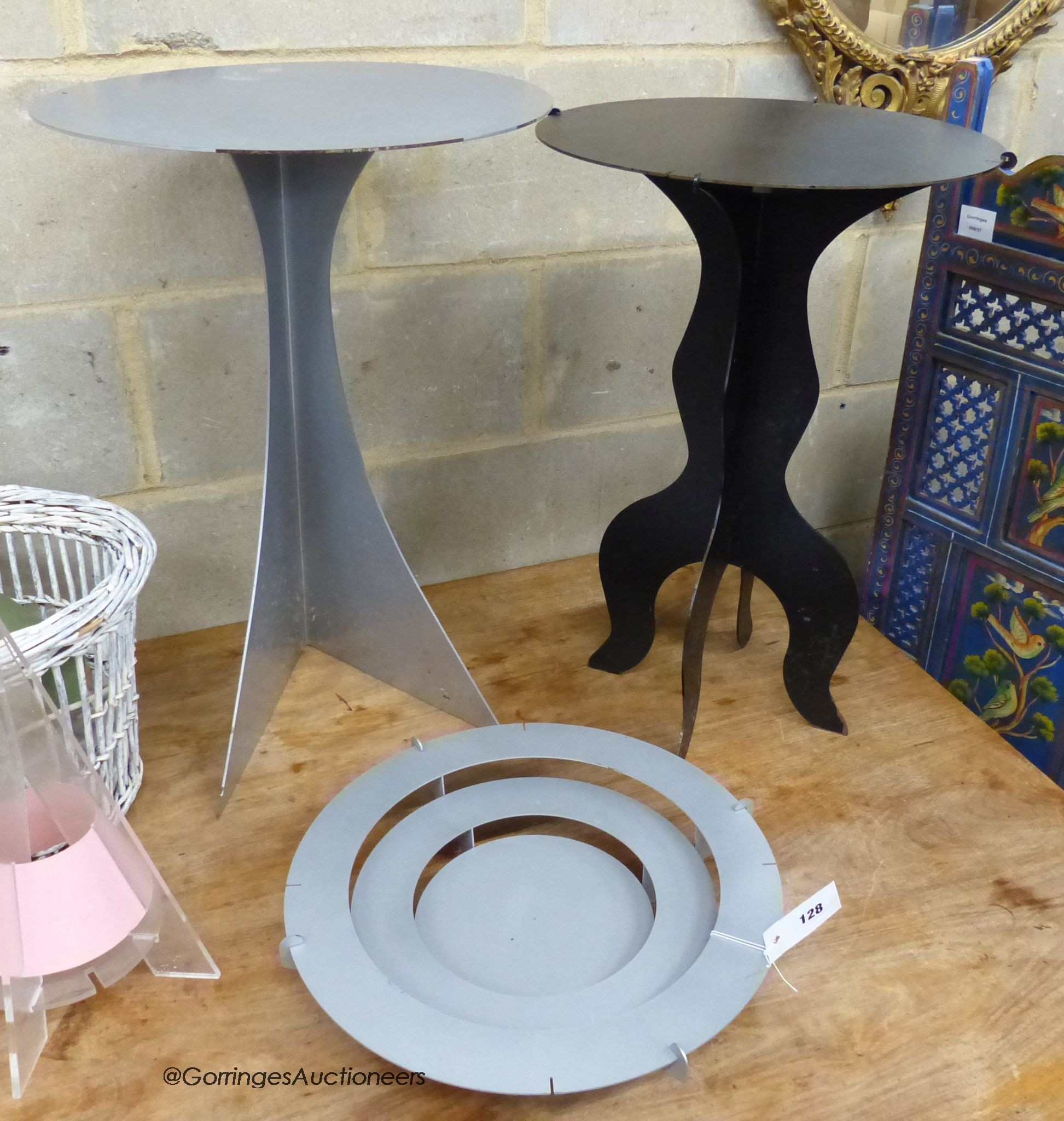 Bill Gill - a group of laser cut powder coated steel items, two lamp tables, a fruit bowl and a mirrored hanging shelf, early 1990's retailed by Liberty & Co.