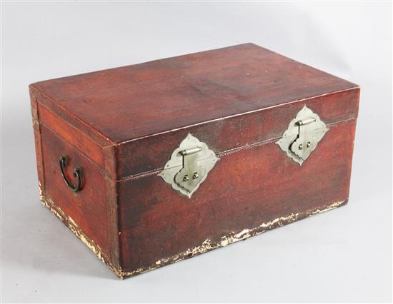 A Chinese lacquered leather trunk, W.2ft 7in. A Chinese lacquered leather trunk, W.2ft 7in.