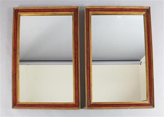 A pair of rectangular gilt and red lacquered wall mirrors A pair of rectangular gilt and red lacquered wall mirrors