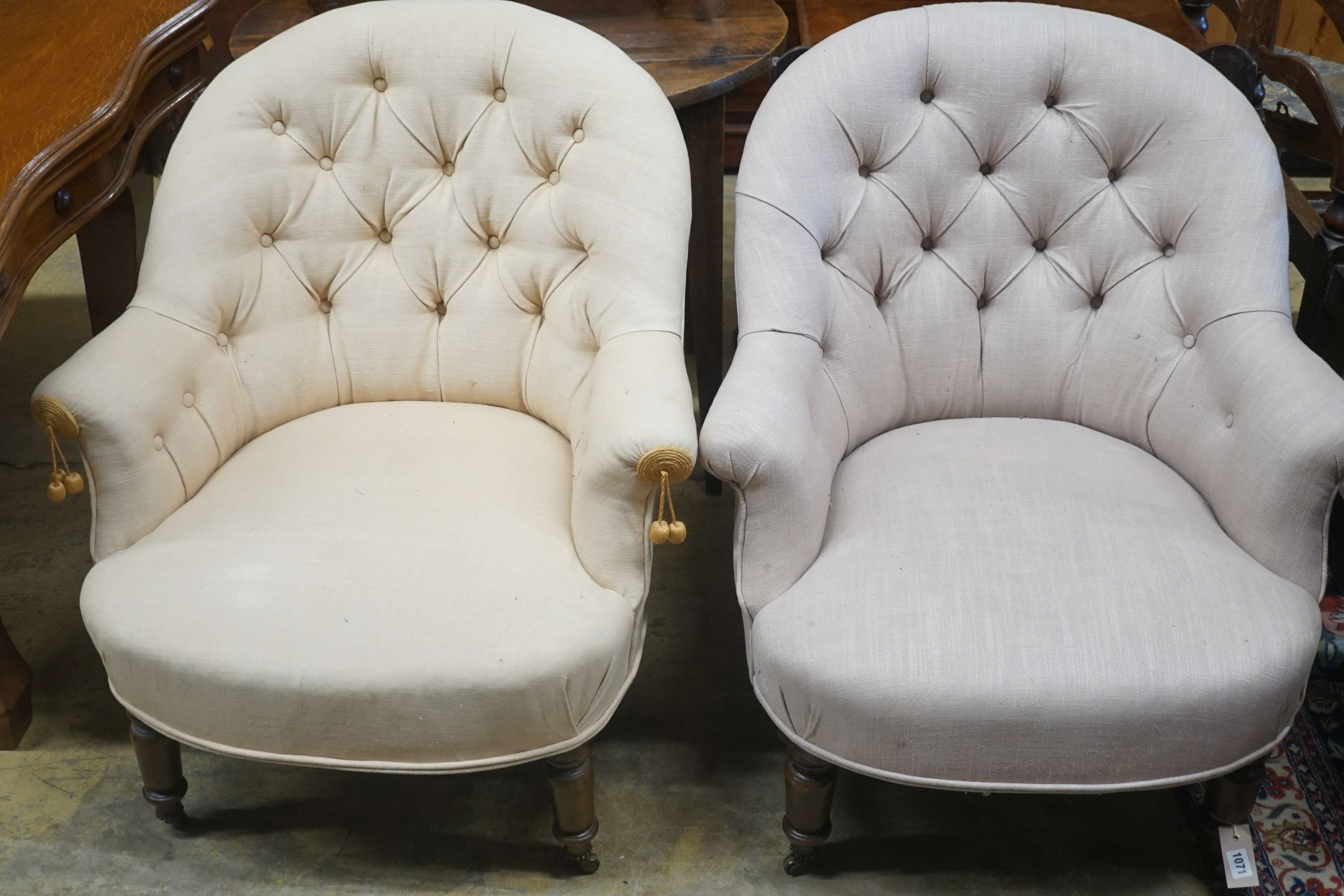 A pair of Victorian upholstered button back tub framed chairs