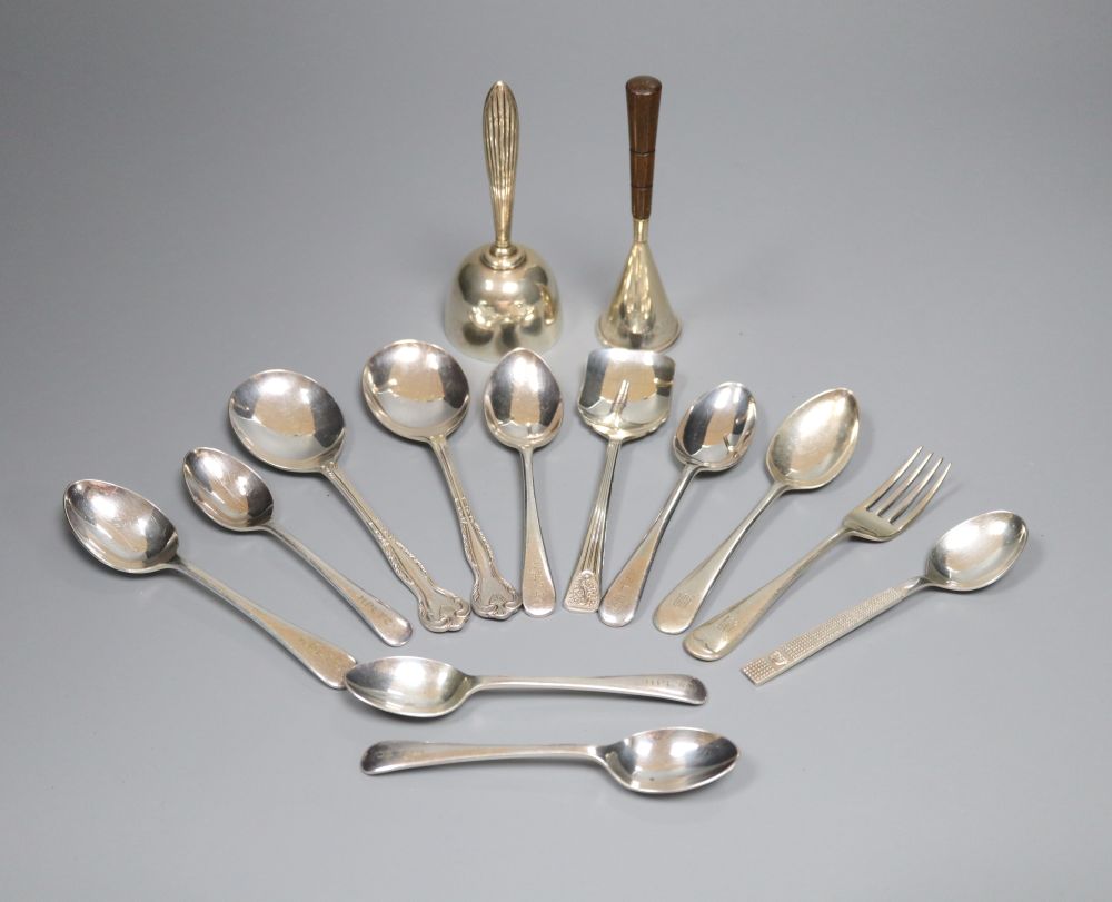 A silver christening knife and fork, a modern silver hand bell, a similar sterling bell and minor plated spoons.