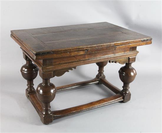 A mid 17th century Dutch oak draw leaf table extended 7ft 1.5in. A mid 17th century Dutch oak draw leaf table extended 7ft 1.5in.