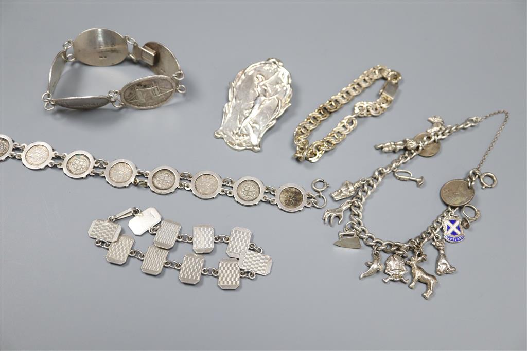 A stylish 925 brooch, silver monument bracelet, charm bracelet etc.