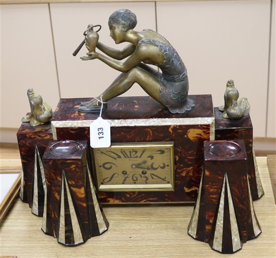 A 1930s faux tortoiseshell and faux mother-of-pearl spelter mounted figural clock garniture clock height 41cm A 1930s faux tortoiseshell and faux mother-of-pearl spelter mounted figural clock garniture clock height 41cm