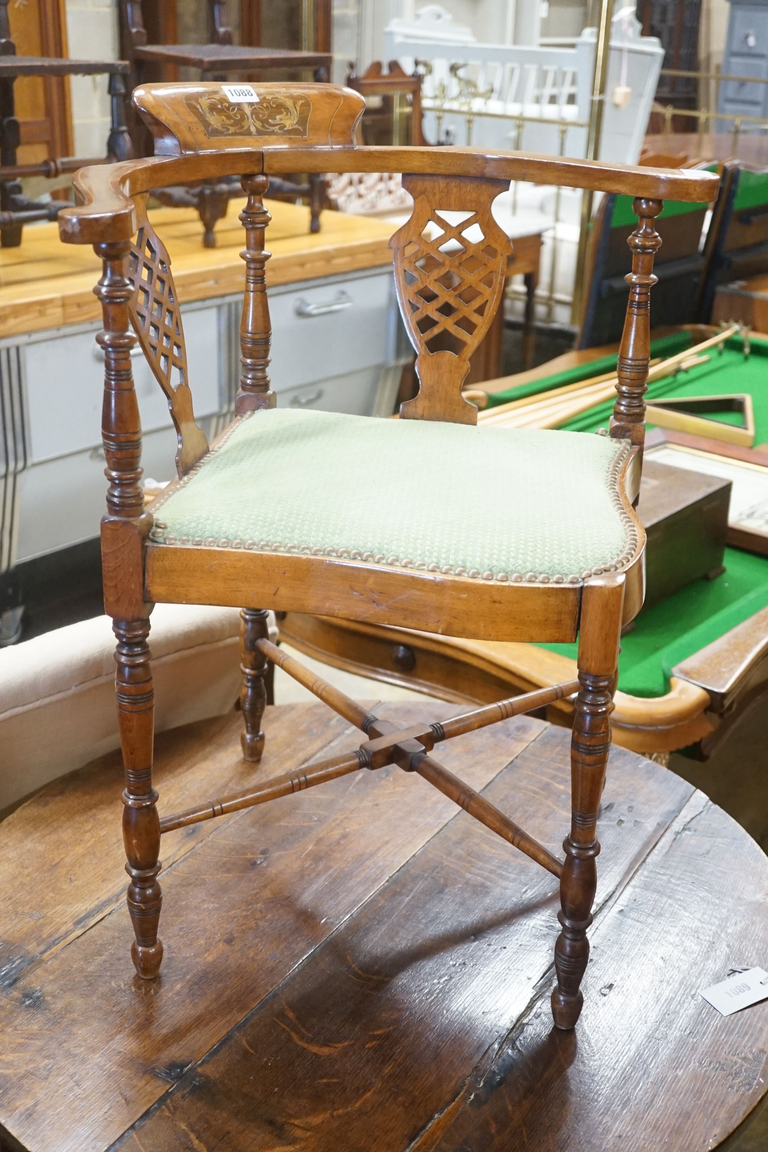 A late Victorian walnut corner elbow chair