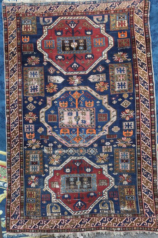 A Shirvan blue ground rug, 9ft 3in by 6ft 4in. A Shirvan blue ground rug, 9ft 3in by 6ft 4in.