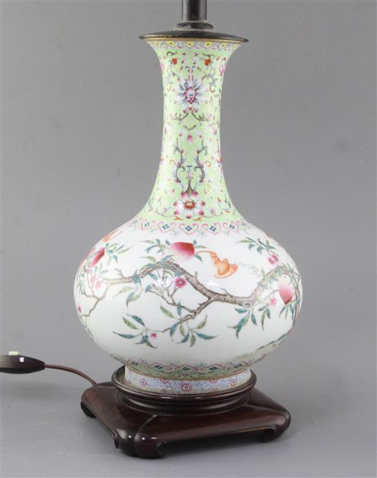 A Chinese famille rose nine peach bottle vase, Qing dynasty, total height 48.5cm including stand and fittings, some restoration A Chinese famille rose nine peach bottle vase, Qing dynasty, total height 48.5cm including stand and fittings, some restoration