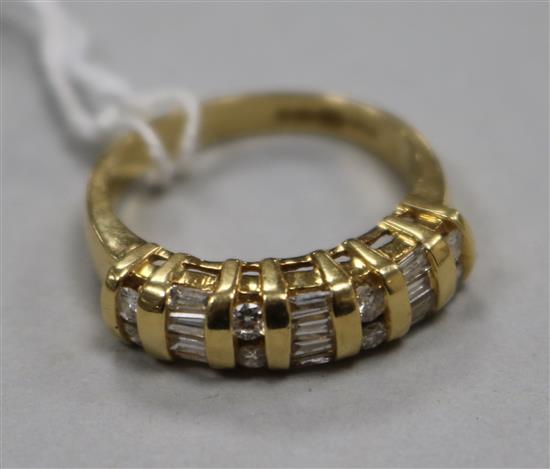 A modern 18ct gold, round and baguette cut diamond set half hoop ring, size M. A modern 18ct gold, round and baguette cut diamond set half hoop ring, size M.