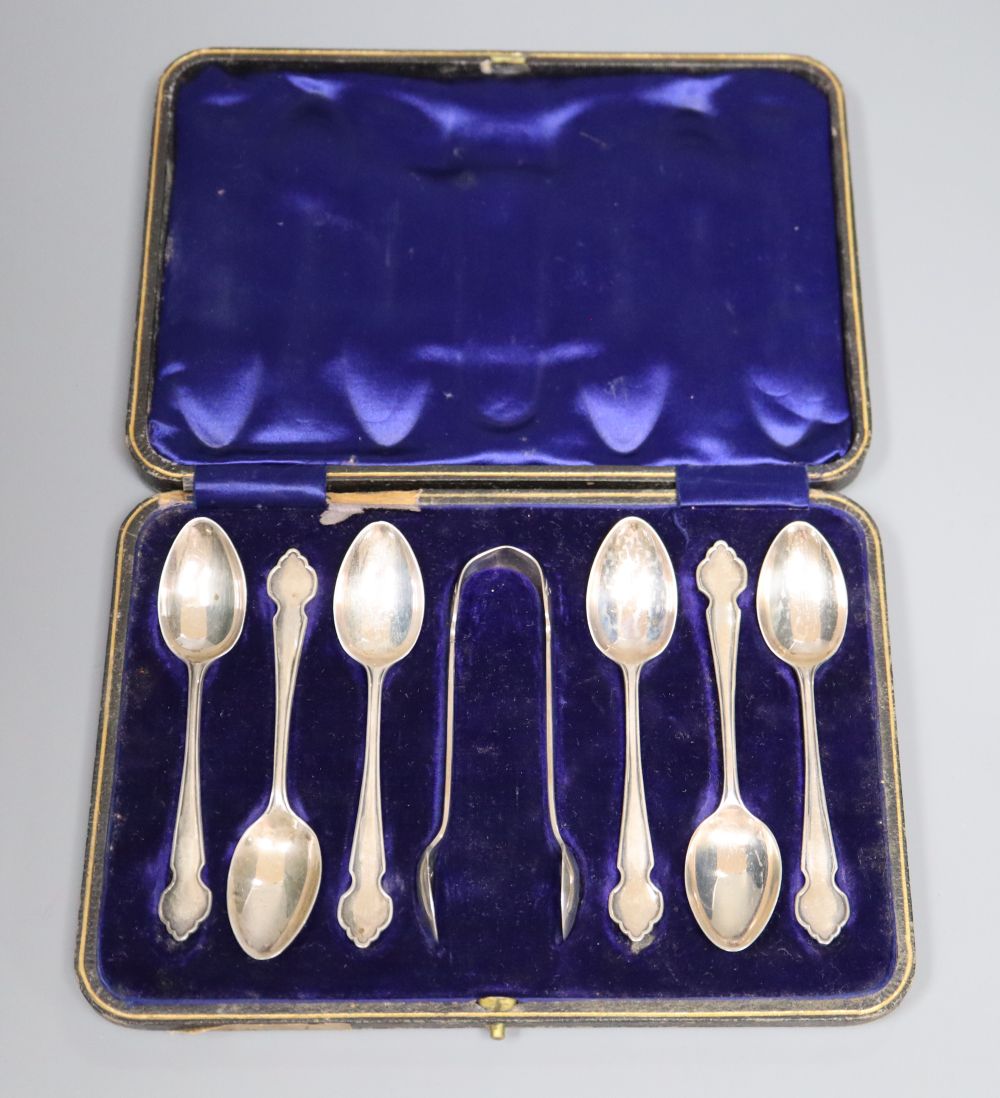 A cased set of six George V silver teaspoons and matching sugar tongs, Sheffield, 1914.