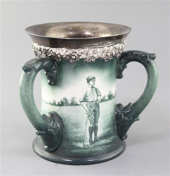 A Lenox Ceramic Art Company golf three handled mug, c.1905, height 6.5in., rim crack A Lenox Ceramic Art Company golf three handled mug, c.1905, height 6.5in., rim crack