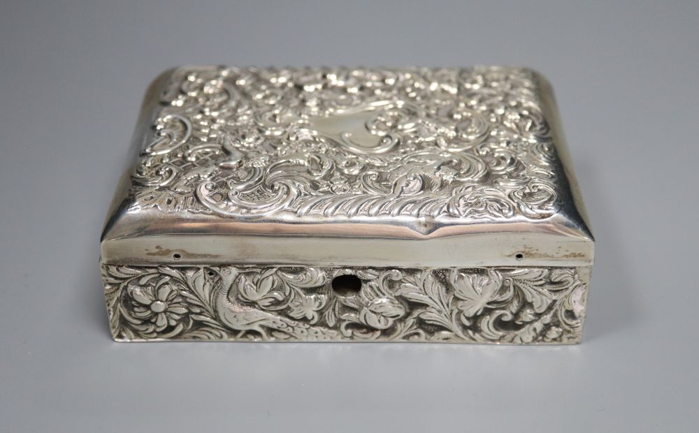 A late Victorian repousse silver mounted lidded rectangular box, with compartmental wooden interior, London, 1895 (a.f.),