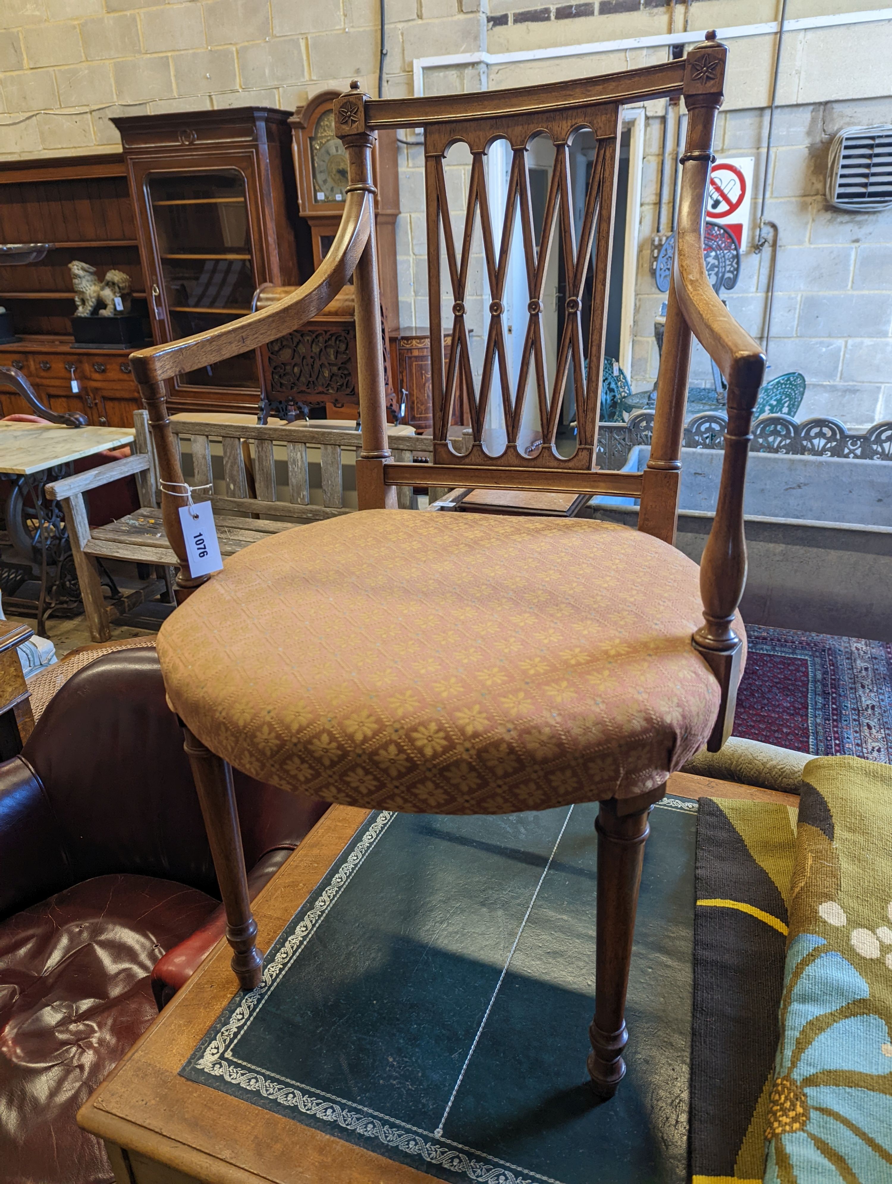 A Sheraton design mahogany elbow chair, width 54cm, depth 44cm, height 93cm