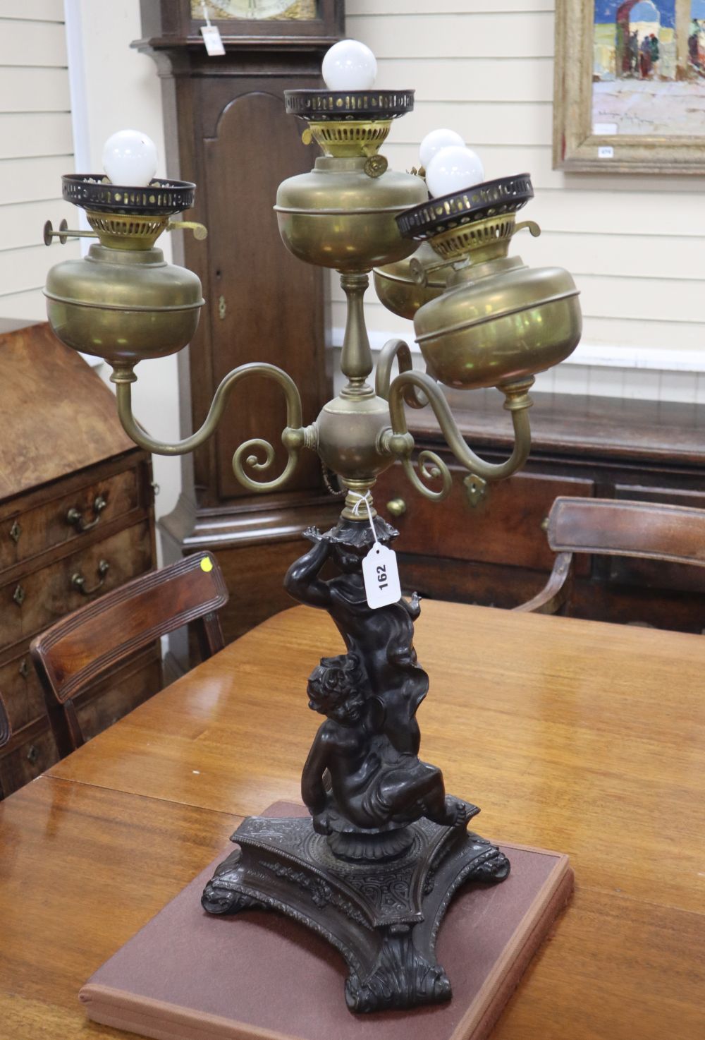 An Edwardian brass mounted bronzed spelter four light table lamp, c. 1900, height 76cm