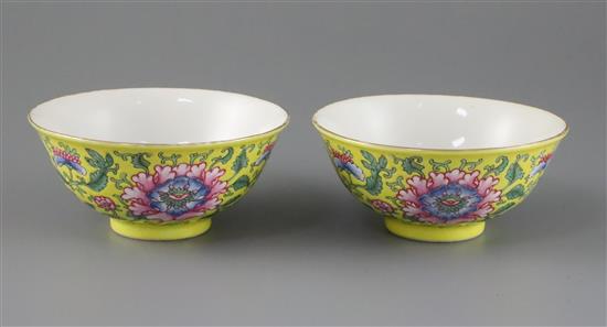 A pair of Chinese yellow ground famille rose bowls, Daoguang six character seal mark and probably of the period (1821-50), Diam.11.5cm A pair of Chinese yellow ground famille rose bowls, Daoguang six character seal mark and probably of the period (1821-50), Diam.11.5cm