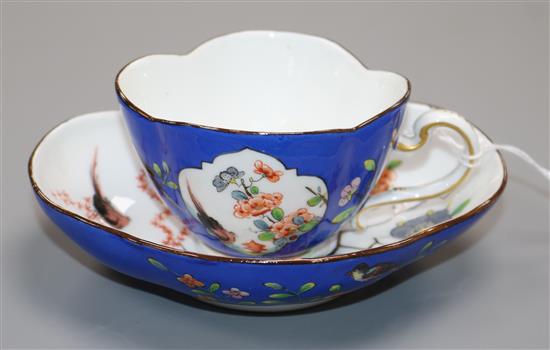 A Meissen cup and saucer A Meissen cup and saucer