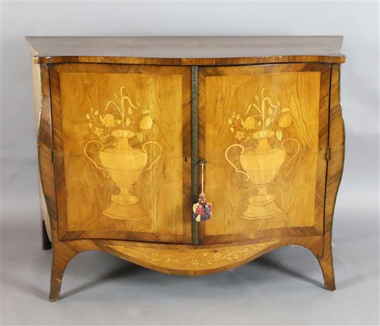 A late 19th century French marquetry inlaid serpentine commode, W.3ft 10in. D.1ft 8in. H.2ft 8.5in.