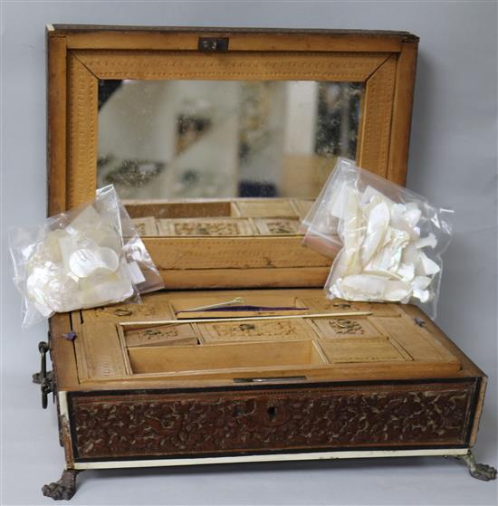 A collection of Chinese mother of pearl counters and an Indian sandalwood sewing box A collection of Chinese mother of pearl counters and an Indian sandalwood sewing box